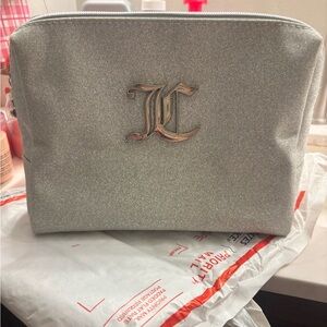 NEW JUICY COUTURE Silver Glittery make up/ toiletry bag w/ new travel bottle.